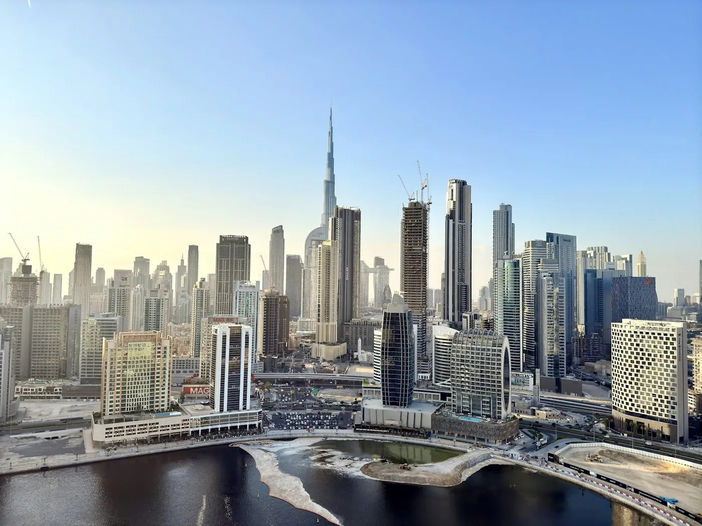 Dubai Business Bay skyline with the Burj Khalifa in daylight